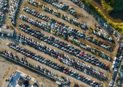 Aerial top view of used car auction for sale a parking lot